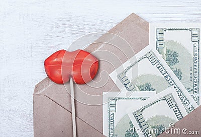 Symbol selling love and money bribe. money, women's lips Stock Photo