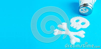 Symbol Skull and crossbones written salt. Salt kills. Crumbled on a blue background Stock Photo