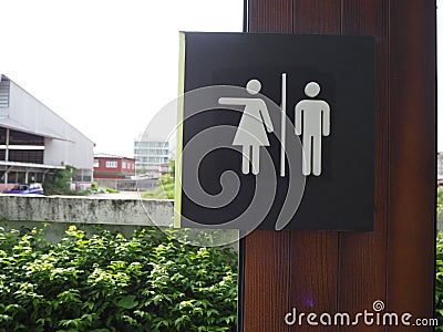 Symbol to tell the male and female toilets in the park,design symbol in the park , The way to the toilet in the park,The symbol o Stock Photo