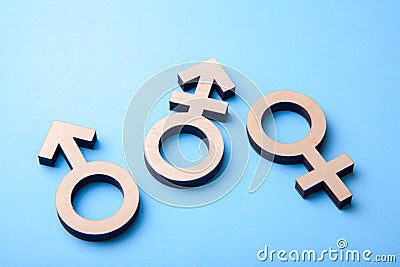 Symbol of transgender and gender symbols of man and woman of tree on blue Stock Photo