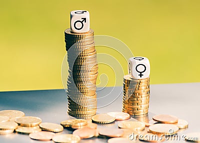 Symbol for unequal payment. Gender symbols on different high stacks of coins Stock Photo