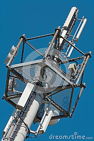 Modern transmission tower with blue sky in the background Stock Photo