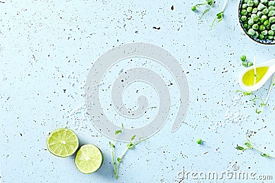 Symbolic food background with lime, pea sprouts, sea salt and frozen peas Stock Photo