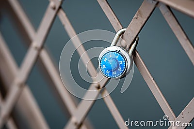 A symbolic padlock at the Brooklyn Bridge railing, New York, USA Stock Photo