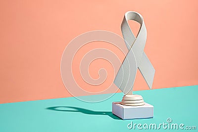 Symbolic pure white ribbon trophy over a bicolor background Stock Photo