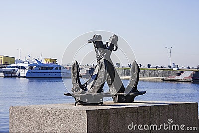 A symbolic sculpture of an Anchor on the granite promenade in the port city of Kronstadt. Russian Federation. Stock Photo