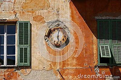 Symbolism time: vintage watch on a shabby wall Stock Photo