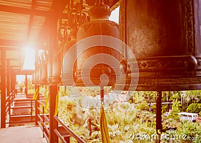 Symbols of Buddhism. Bells. South-Eastern Asia. Details of buddhist temple Stock Photo