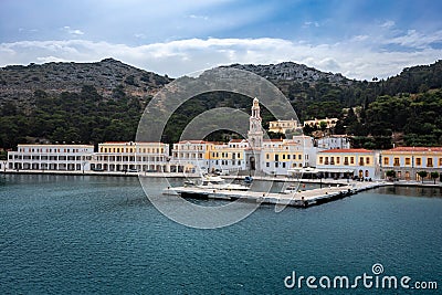 Monastery of Archangel Michael on the sea front of Panormitis village, Symi, Greece. Editorial Stock Photo