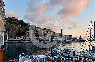 Symi Island Harbour with the amazing pink sunrise Editorial Stock Photo