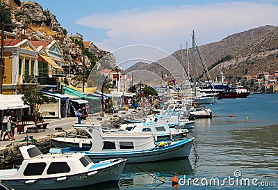 Symi town, Symi island, pictorial view of colorful houses and Yialos harbour Editorial Stock Photo