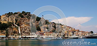 Symi town, Symi island, pictorial view of colorful houses and Yialos harbour Editorial Stock Photo