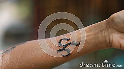 The symmetrical lines of s on a persons arm a reminder of the balance and harmony needed to sustain life. Stock Photo