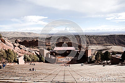 Symmetrical shot of RedRocks Amphitheater on a Beautiful Sunny Skies Day with Surrounding Mountain Landscape Background Stock Photo