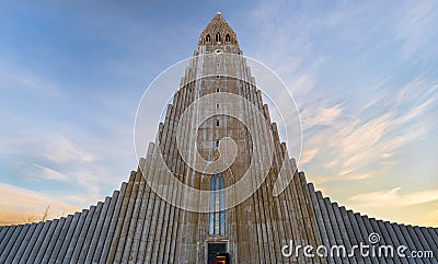 Symmetrical view of the minimalist architecture of HallgrÃ­mskirkja Cathedral based on the basalt formations of Iceland Editorial Stock Photo