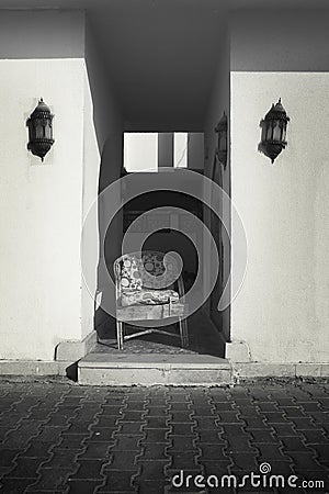 Symmetry of a lonely chair Stock Photo