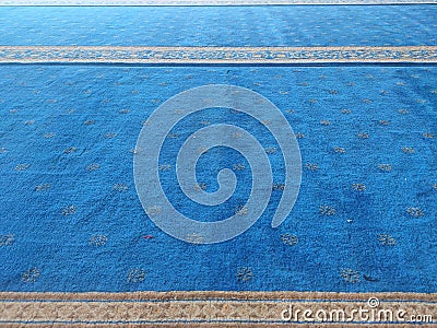 Symple of Blue carpet space for pray Stock Photo