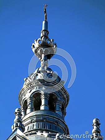 Synagogue building`s metallic grey zink tower under blue sky Stock Photo