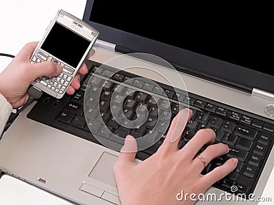 Synchronization of data between pda and laptop Stock Photo