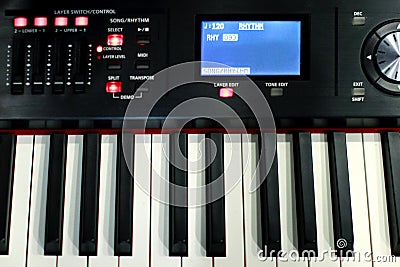 The synthesizer is in the recording Studio. Included electronic piano with burning scoreboard. Large white and black keys Stock Photo