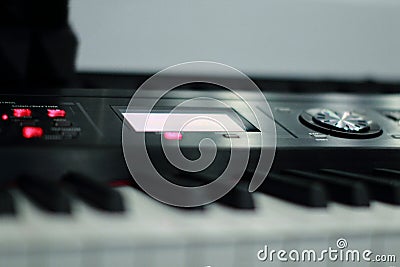 The synthesizer is in the recording Studio. Included electronic piano with burning scoreboard. Large white and black keys Stock Photo