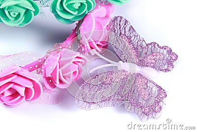 Synthetic butterfly with beautiful rose hair bands. Stock Photo