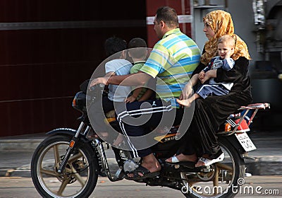 A Syrian family on motorbike Editorial Stock Photo