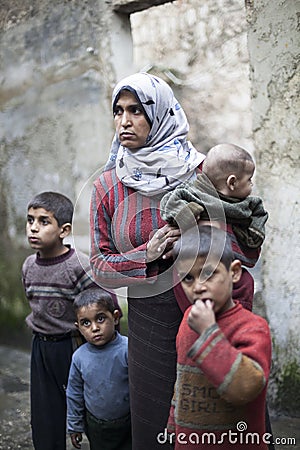 Syrian mother with her childern in Aleppo. Editorial Stock Photo