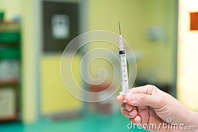 Syringe and ampule, medical injection in hand. Hospital and Medical concept Stock Photo