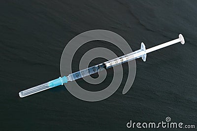 Syringe with drug inside Stock Photo