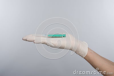 Syringe hand in glove Stock Photo