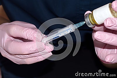 Syringe for injection in hands of beautician Stock Photo