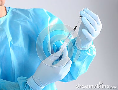 Syringe, medical injection in hand, palm or fingers. Medicine plastic vaccination equipment with needle. Nurse doctor Stock Photo