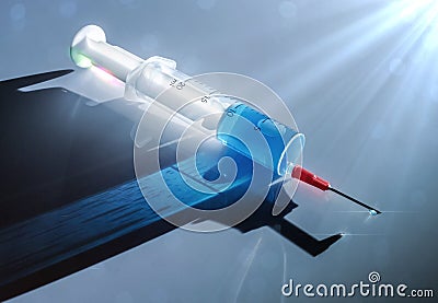 Syringe with medication illuminated laterally Stock Photo