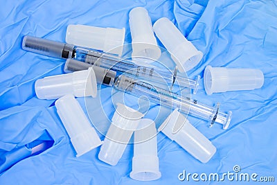 Syringe and needles with glove Stock Photo