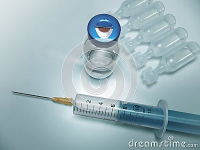 Syringe on table Stock Photo
