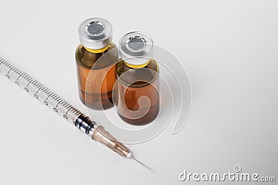 Syringe with two ampules, used for mesotherapy and face filler on white background. Stock Photo