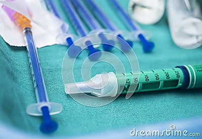 Syringes of insulin medication next to medicine vials prepared in hospital Stock Photo