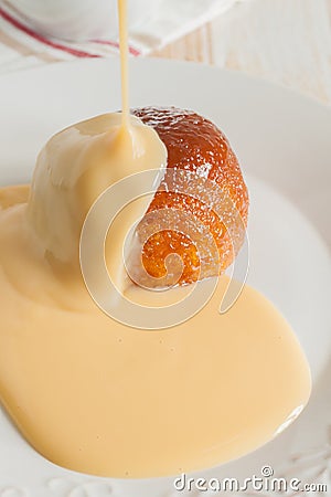 Treacle or Syrup Sponge and Custard Stock Photo