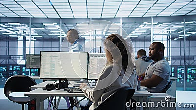 System admin working in diverse computer network security data center Stock Photo