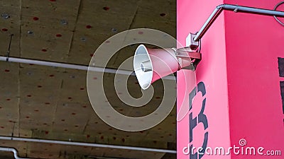 System of alert for population. Mounted on concrete poles under the ceiling of a building to inform an organization or community. Stock Photo