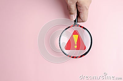 System warning error popup and maintenance inside magnifier. cyber attack on online network error system. Cybersecurity Stock Photo