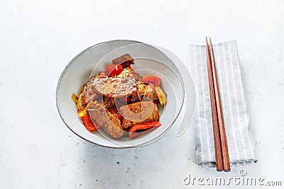 Szechuan traditional dish Hui Guo Rou, spicy roasted pork with leek and bell pepper Stock Photo
