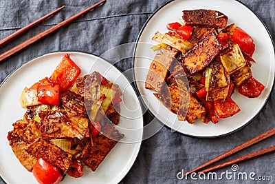 Szechuan traditional dish Hui Guo Rou, spicy roasted pork with leek and bell pepper Stock Photo