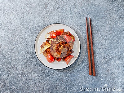 Szechuan traditional dish Hui Guo Rou, spicy roasted pork with leek and bell pepper Stock Photo