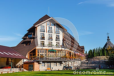 Wooden building of a hotel in open air museum in Szymbark village, Poland Editorial Stock Photo