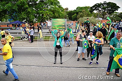 Juciane Cunha holds the sign written: `Brazil is green and yellow yes! No to red!` Editorial Stock Photo