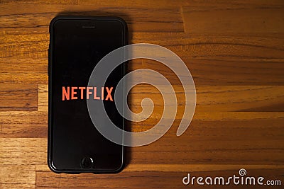 Leading platform in the movie streaming segment, netflix with the application open on a cell phone. Editorial Stock Photo