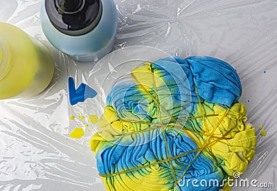 T-shirt yellow and blue paint in tai dai technique Stock Photo