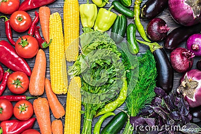 A table arrangement of a variety of fresh fruits and vegetables sorted by colors Stock Photo